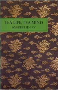 The cover of 'Tea Life, Tea Mind'. A simple dark red with gold clouds, and the title printed over a green band.